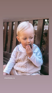 Knit dungarees with white buttons