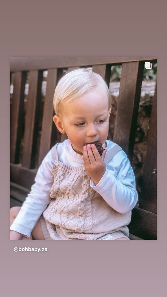 Knit dungarees with white buttons