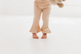 Frilly layered onesie, bell bottom pants & bow headband