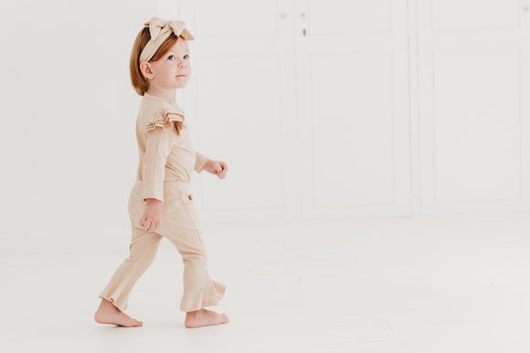Frilly layered onesie, bell bottom pants & bow headband