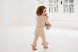 Frilly layered onesie, bell bottom pants & bow headband