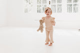 Frilly layered onesie, bell bottom pants & bow headband